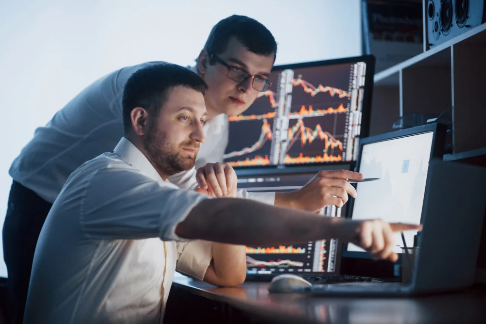 a picture of two Cisco Certified Internetwork Expert working together