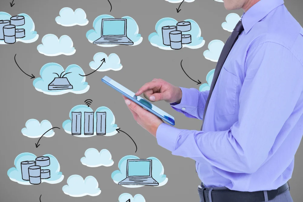a picture of a  Cisco Certified Design Expert (CCDE)  man working on its tablet with cloud illustrations